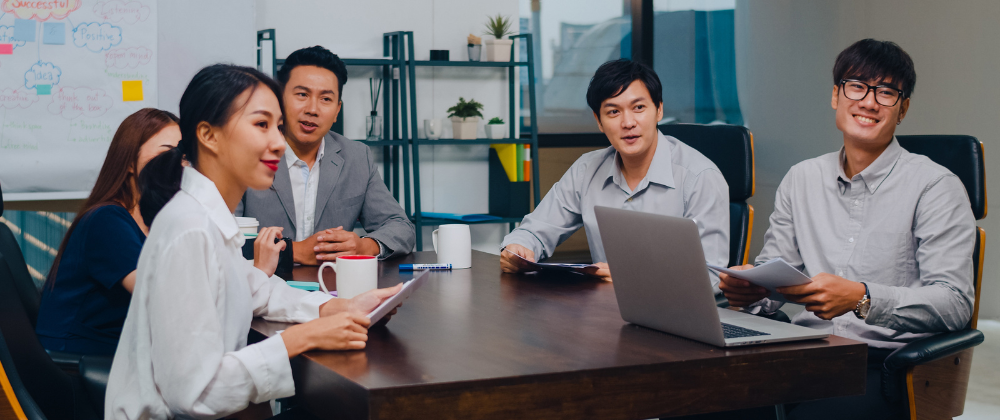 young group of professionals in the conference room having a meeting